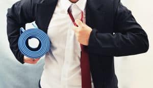 42554307 – business man holding yoga mat , exercise concept